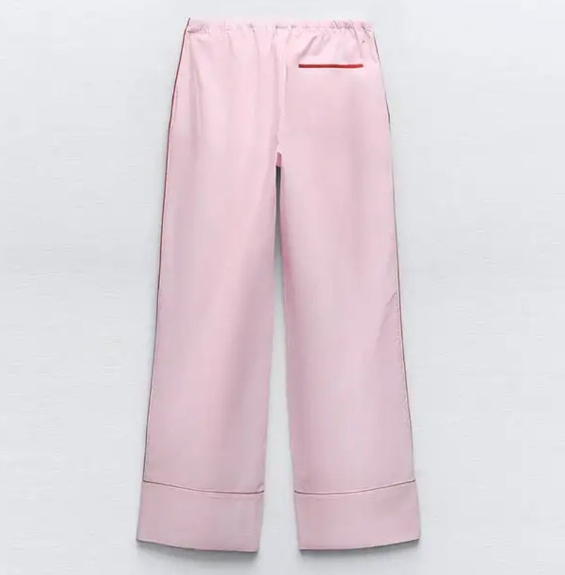 Pink pant with red piping, part of Pink and Red Shirt and Trousers Co Ord set.