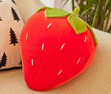  Soft and huggable strawberry pillow, ideal for lounging or napping.