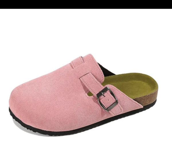 Pink Mules Clogs: Stylish and comfortable footwear for women. Slip into these trendy pink clogs for a fashionable and cozy look.