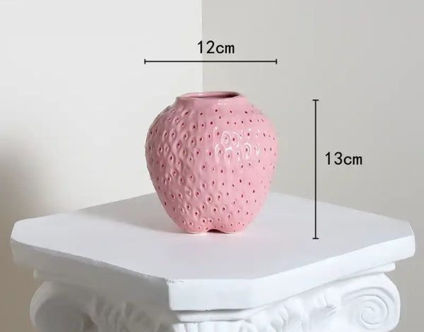 Strawberry Vase in baby pink or red, featuring a perforated design on the side.