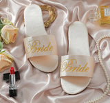 Elegant satin slippers for brides or bridesmaids, perfect for weddings or special occasions.