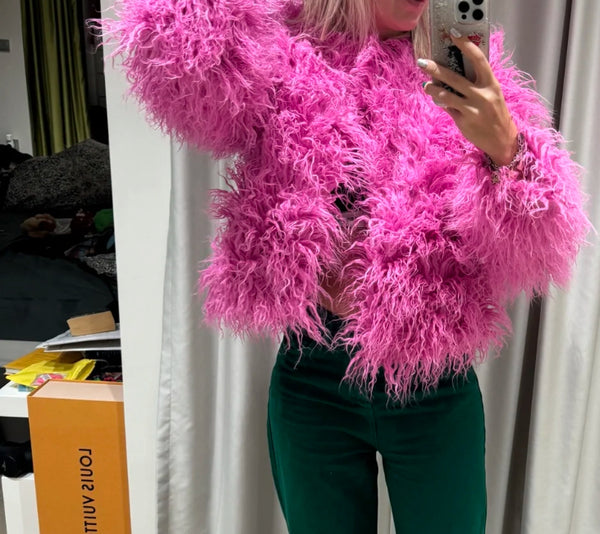 Fashion-forward lady donning a Pink Faux Fur Jacket, capturing a selfie with flair