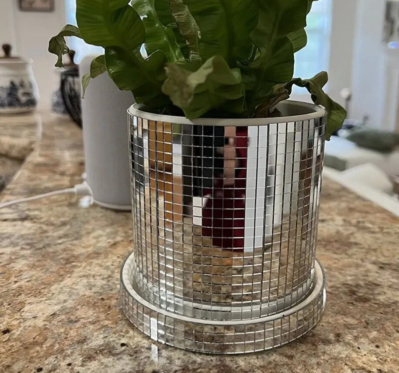 Disco Ball Planter featuring a plant in a mirrored vase on a counter.