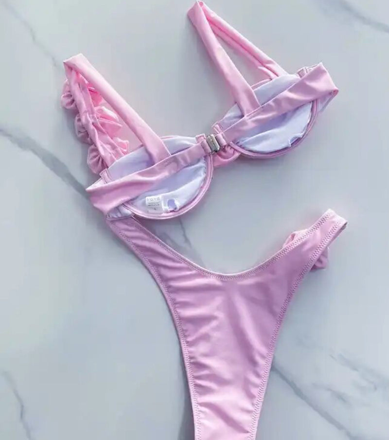 Baby Pink Rose Bikini: A cute two-piece swimsuit in soft pink with rose accents, perfect for a day at the beach or pool