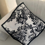 Chic Black and White Branch Cushion - a tree-patterned pillow for a modern touch.