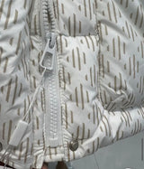 Close-up of zipper on white Pattern Down Puffer Jacket With Hood.