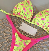 Stylish Cherry Thong bikini featuring Pink and Yellow floral design.