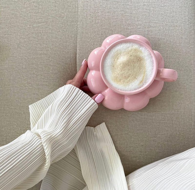 Person holding pink cup with white heart. Product name: Throw and sunflower mug bundle