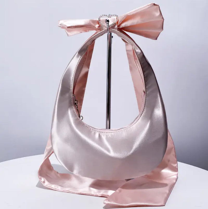 Pink Satin Bow Bag - an elegant purse adorned with a neatly tied bow, perfect for any occasion