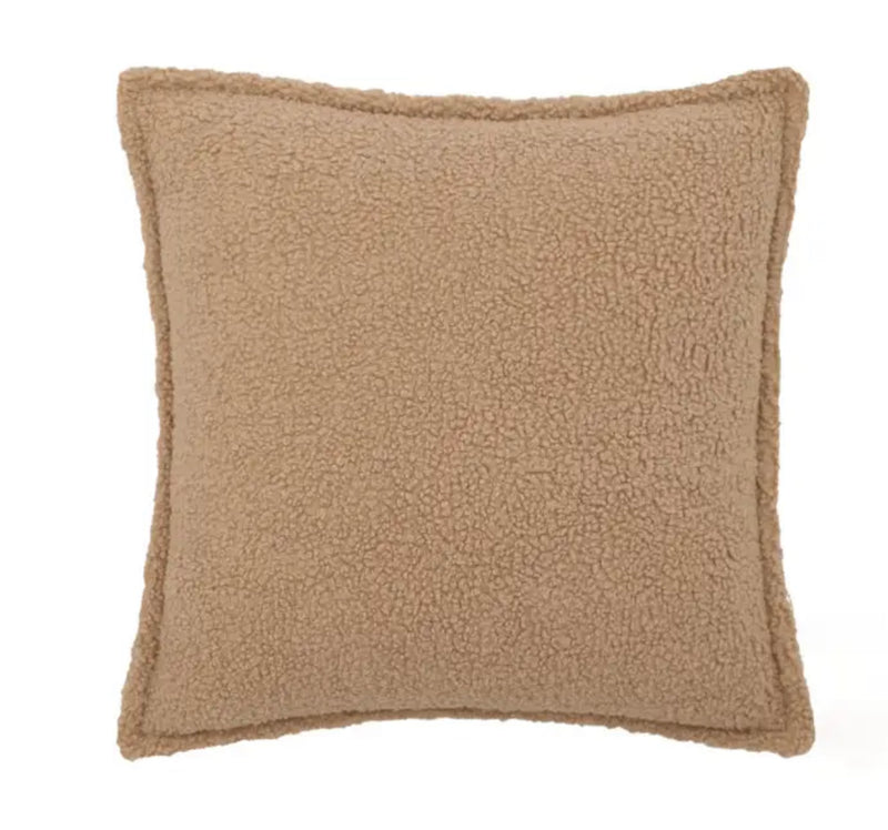 Plush cushion with beige fleece cover, perfect for comfort and relaxation.