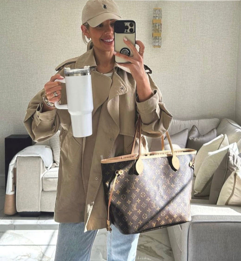 Woman in trench coat and hat taking a selfie with Quencher Insulated Tumbler Straw Stainless Steel Coffee Termos Cup Vacuum Flasks Portable Water Bottle.