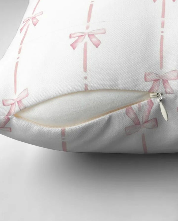 Pink and white ribbon cushion cover with elegant design, perfect for adding a touch of charm to any room