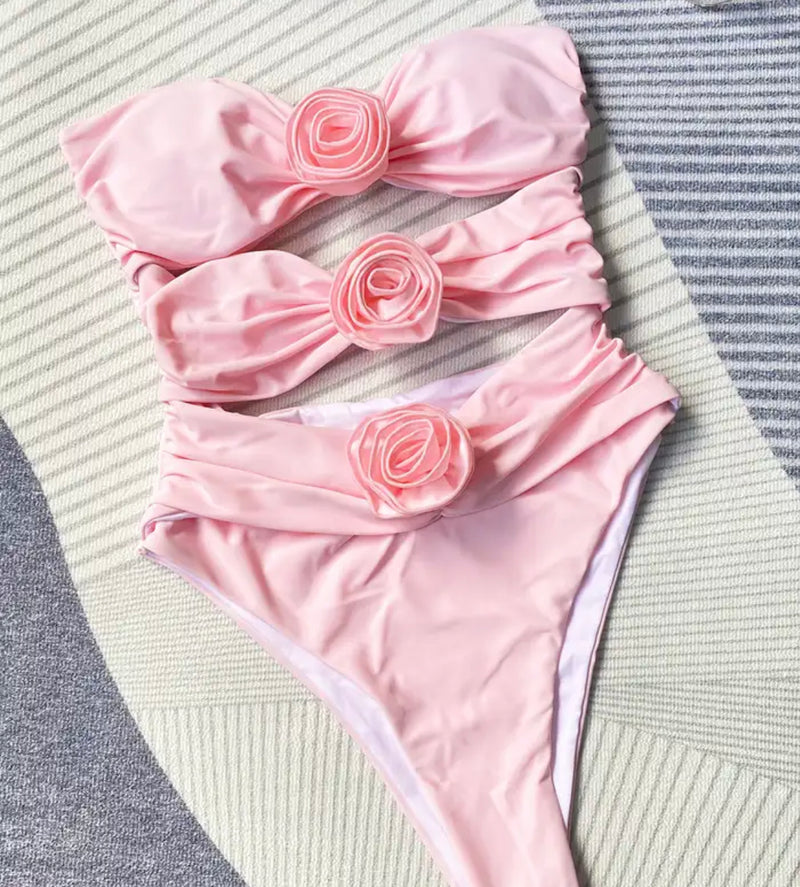 Pink Rose Swimsuit, featuring a floral accent on the side, perfect for a stylish swimwear choice.