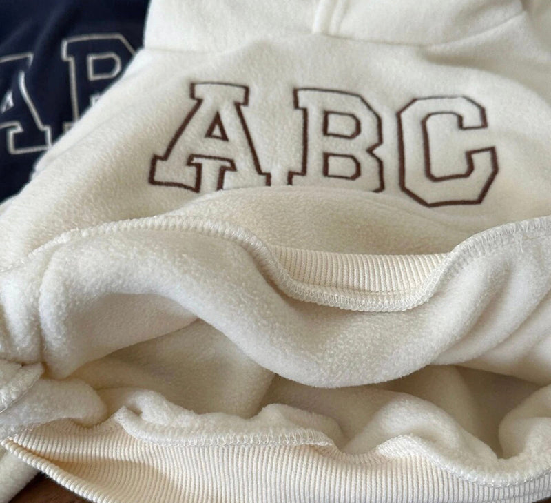 Close-up of white ABC sweatshirt from ABC Kids Soft Tracksuit.