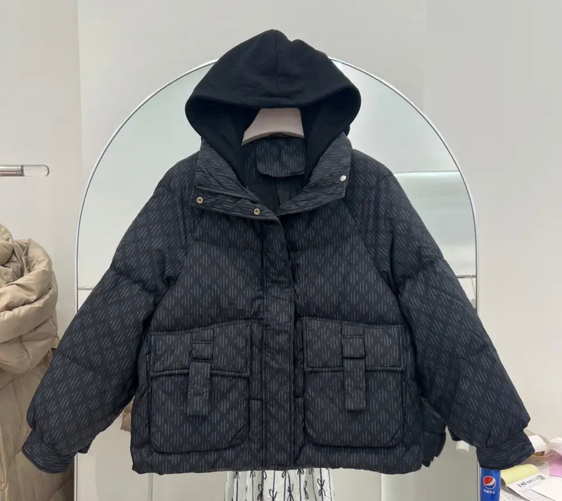 Pattern Down Puffer Jacket With Hood - Black quilted jacket hanging on a rack.