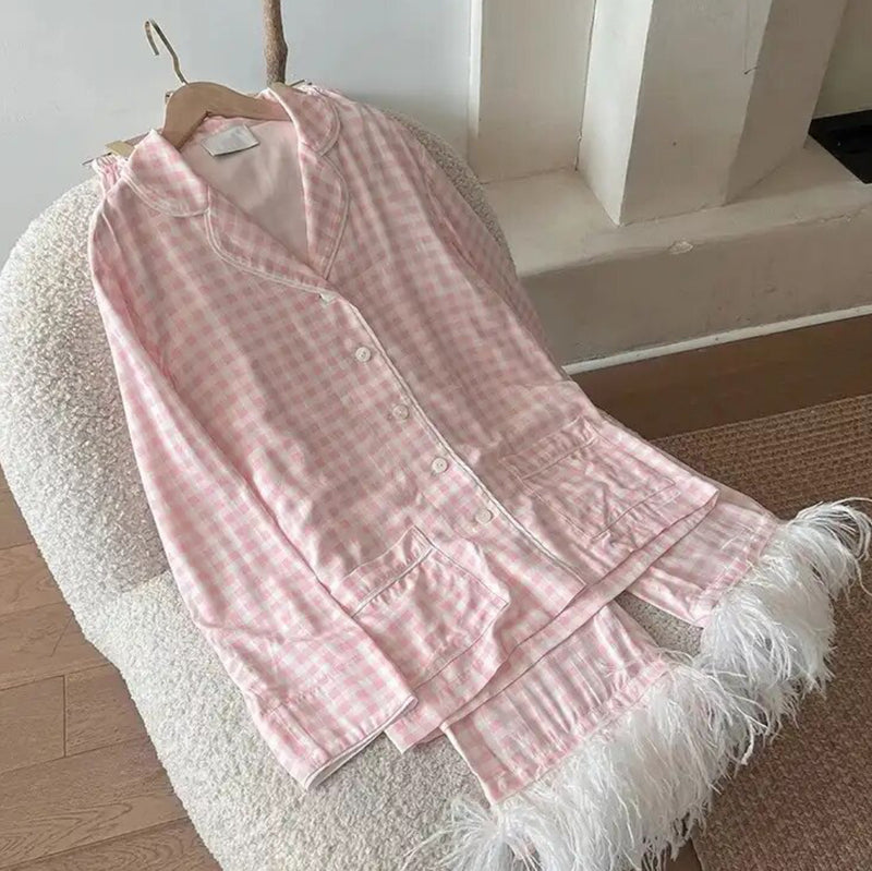 Get cozy in the Pink Checked Feather Pyjamas, a cute pink and white set