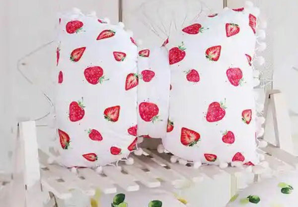 Bow Pillow - White pillow adorned with strawberries.