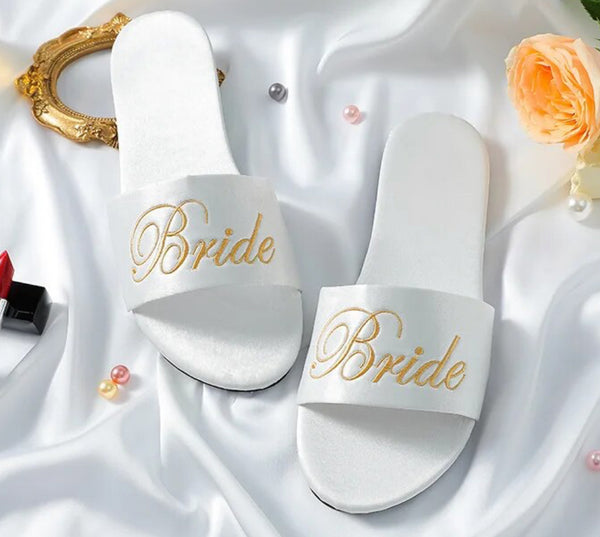 Luxurious satin slippers designed for brides or bridesmaids, ideal for weddings.