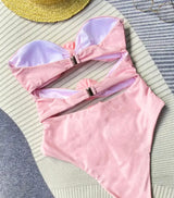 Pink Rose Swimsuit: A trendy pink bikini ensemble featuring a hat and sunglasses.