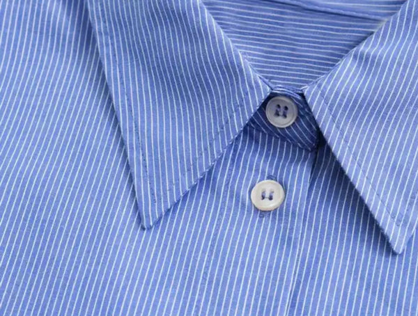 Blue Striped Shirt: A close-up of a stylish blue shirt with white stripes. Perfect for any occasion. Shorts sold separately.