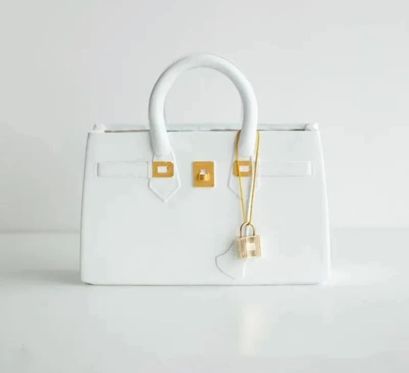 White handbag with gold hardware and lock, product name: Handbag flower vase