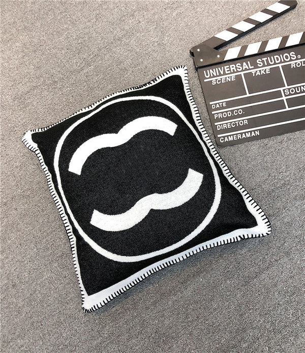 Black and white CC cushion cover case featuring a movie clapper on a pillow